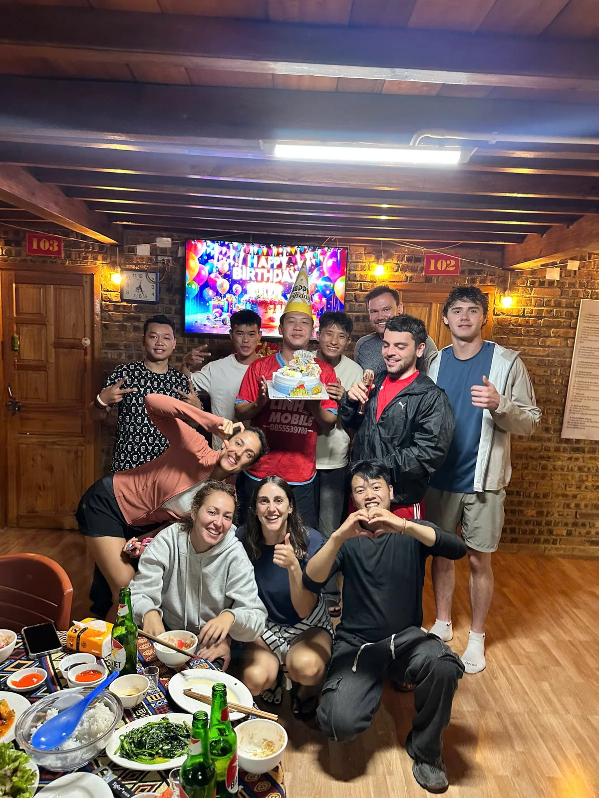 Birthday celebration with cake and party hat after dinner on the Ha Giang Loop